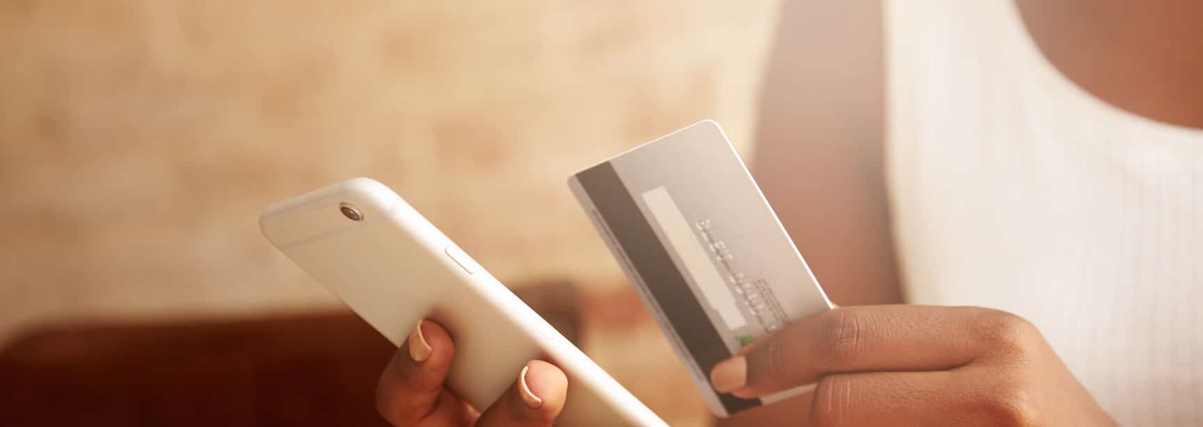 Digital payment to financial inclusion - lady paying with card and phone